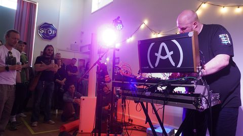 Andy Dobson with clarinet and modular synthesiser